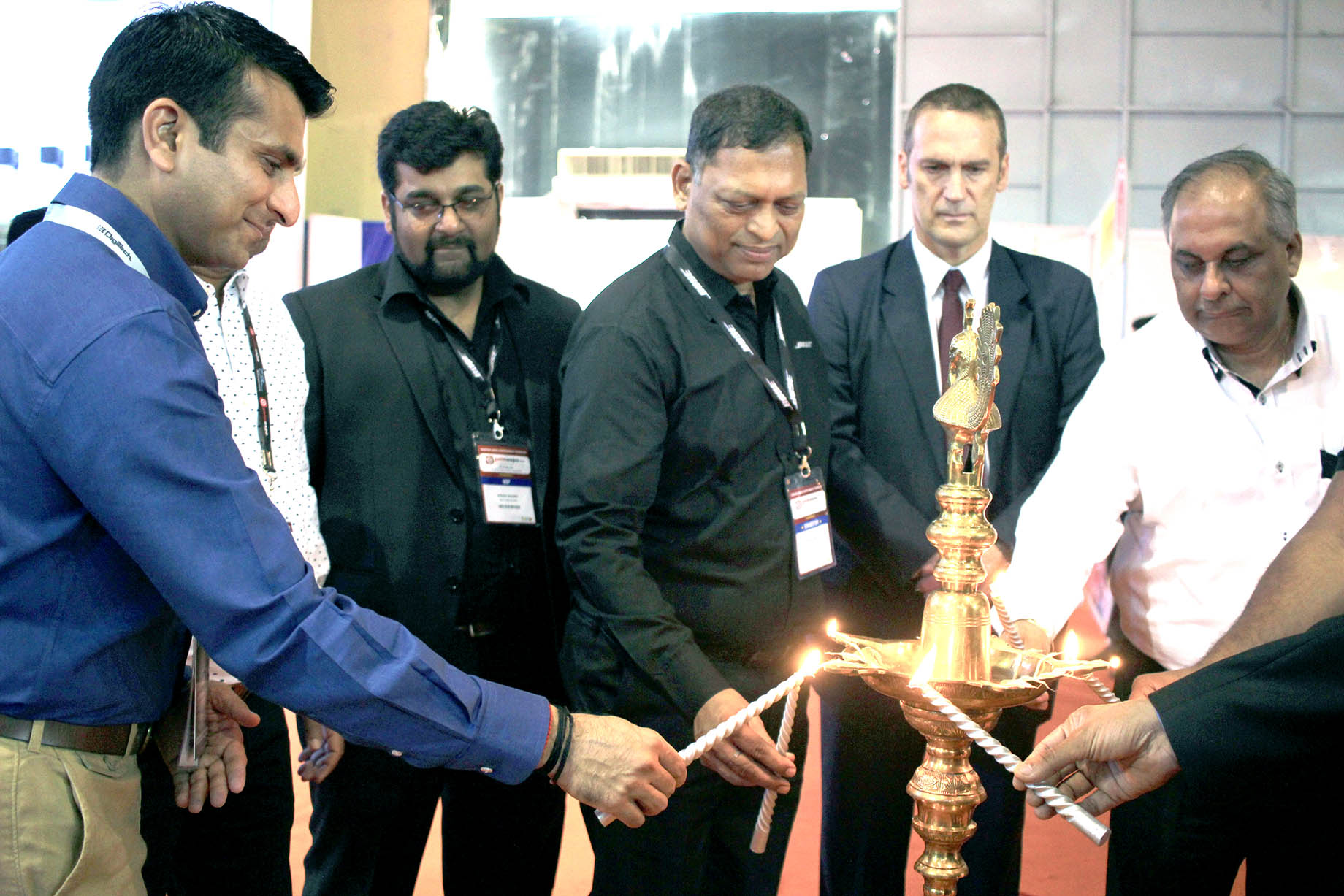 Lighting the lamp for show inauguration